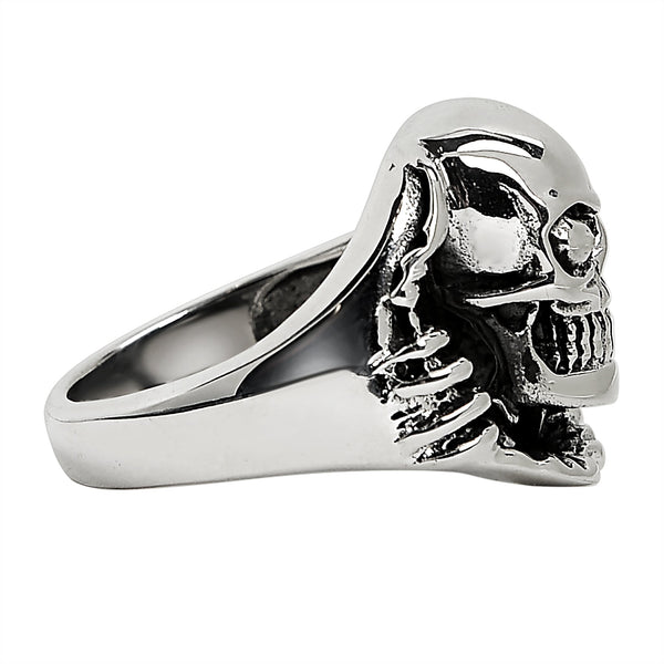 Sterling silver skull tearing through ring side view.