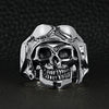 Sterling silver pilot skull ring oon a black leather background.