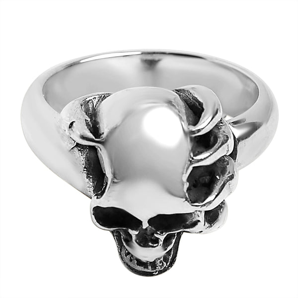 Sterling silver skull in demon hand ring angled down.