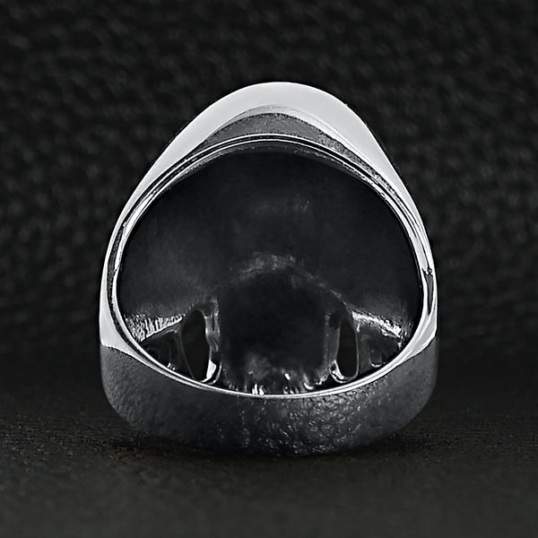Sterling silver black eyed skull with 3rd eye ring back view on a black leather background.